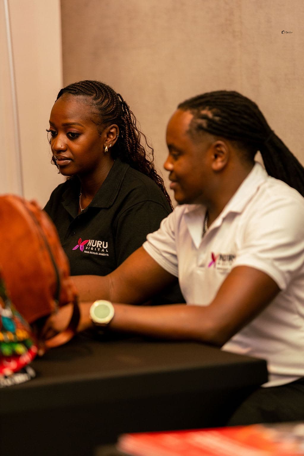 The Nuru Digital team in conversation at their exhibition stand