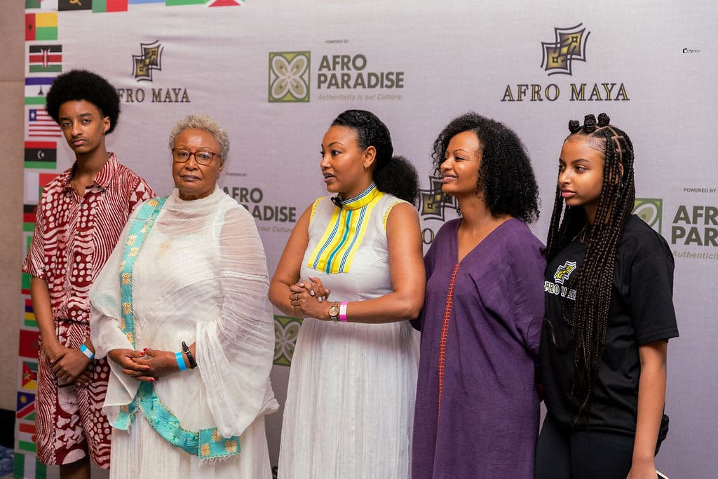 AfroMaya's founding team at the event's photography backdrop