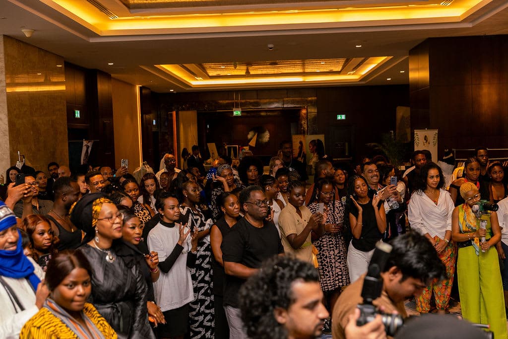 Attendees applauding during the event programme